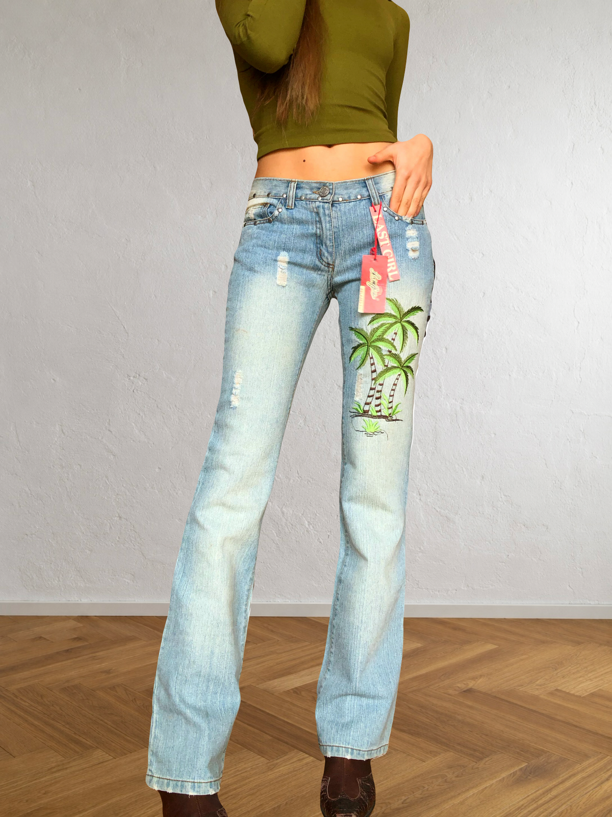 Low-rise bootcut embroidered flared jeans