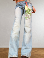 Low-rise bootcut embroidered flared jeans