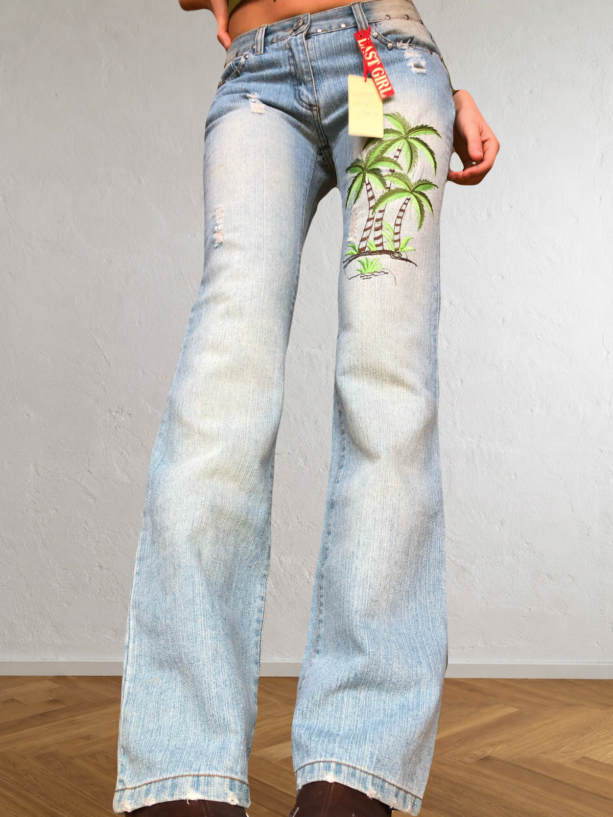 Low-rise bootcut embroidered flared jeans