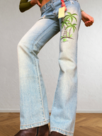Low-rise bootcut embroidered flared jeans
