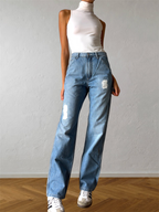 Light-wash 90s jeans with zipper and yellow lettering