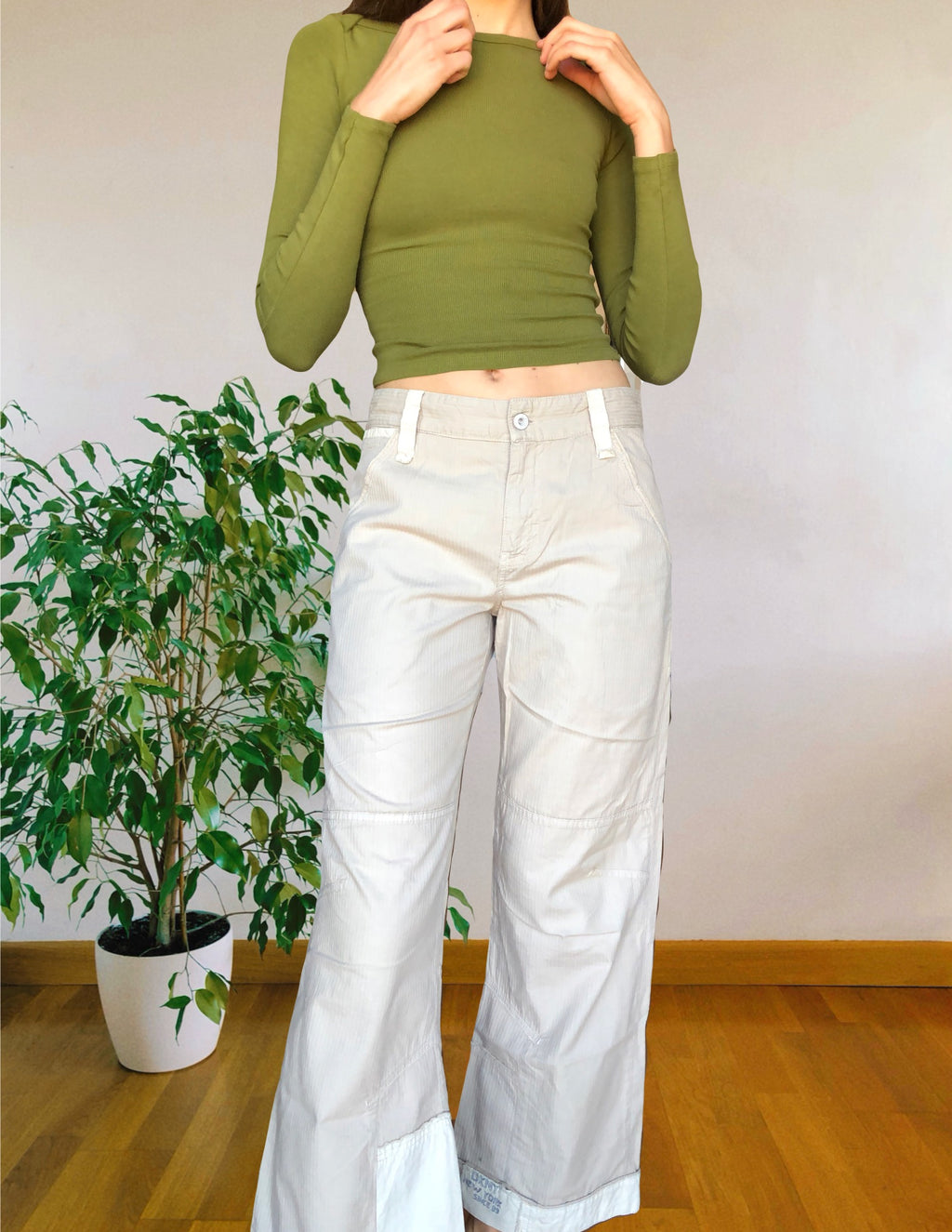Beige wide-leg cargo pants with light-colored inserts