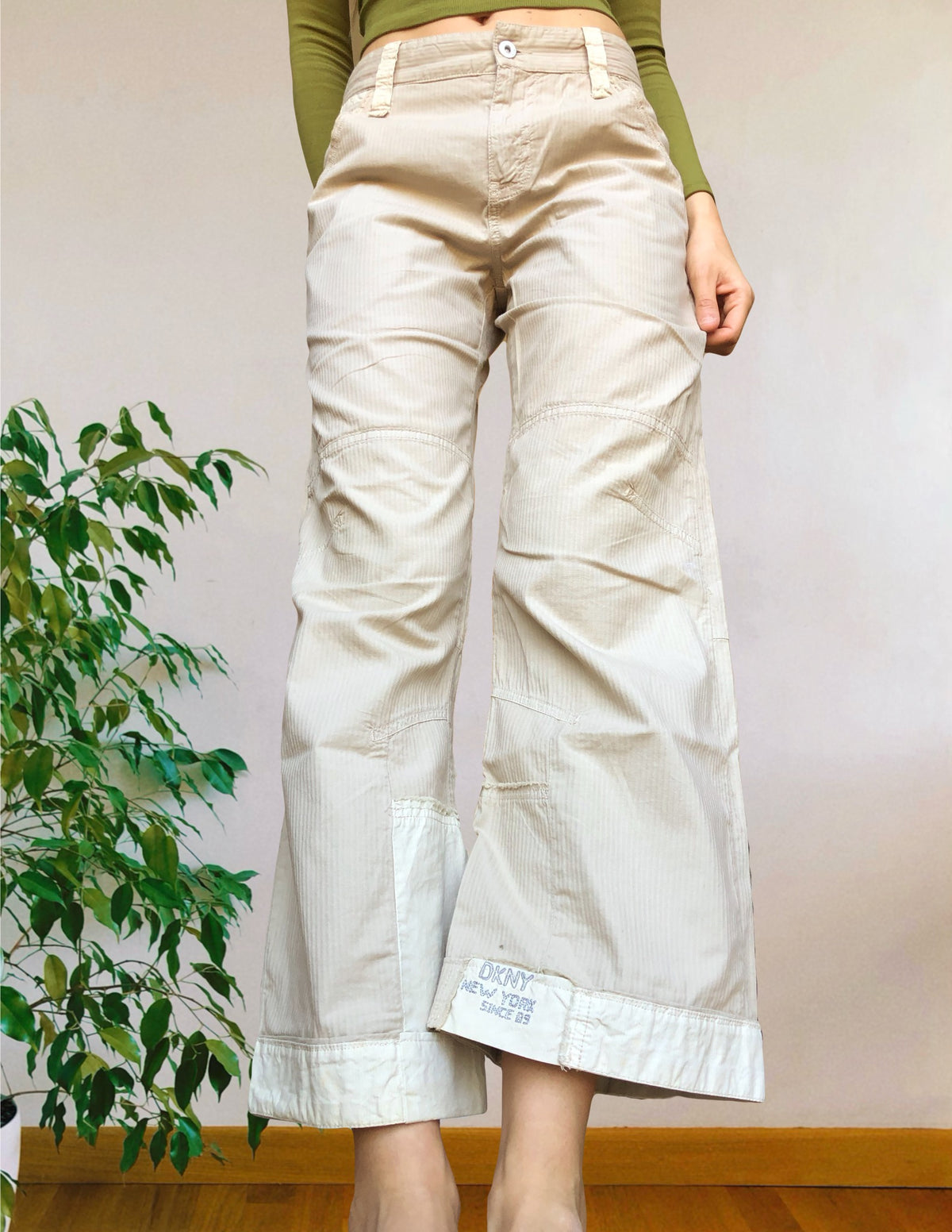 Beige wide-leg cargo pants with light-colored inserts