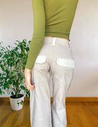 Beige wide-leg cargo pants with light-colored inserts