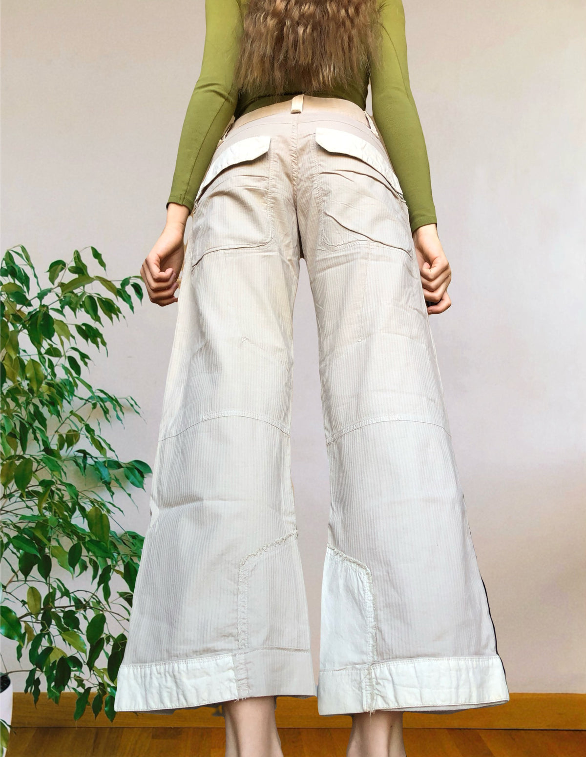 Beige wide-leg cargo pants with light-colored inserts
