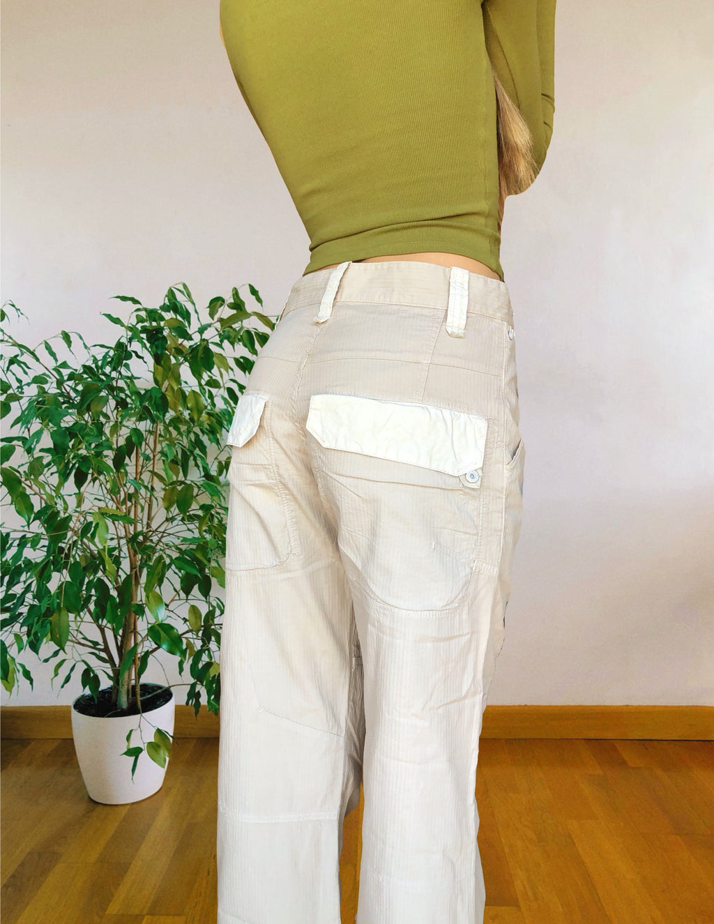 Beige wide-leg cargo pants with light-colored inserts