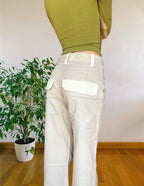 Beige wide-leg cargo pants with light-colored inserts