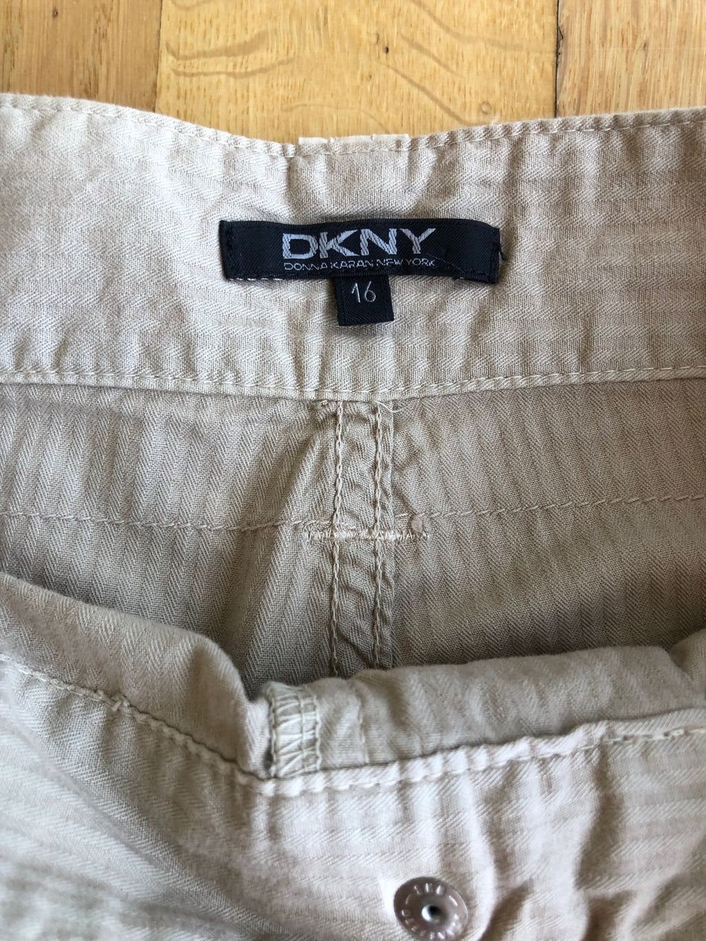 Beige wide-leg cargo pants with light-colored inserts