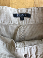 Beige wide-leg cargo pants with light-colored inserts