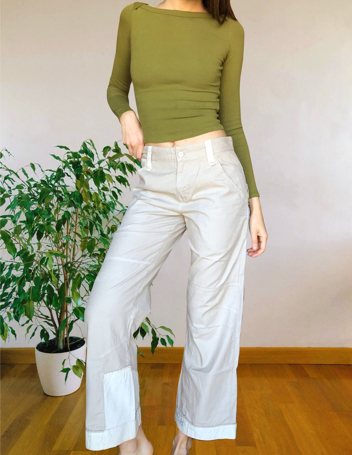 Beige wide-leg cargo pants with light-colored inserts