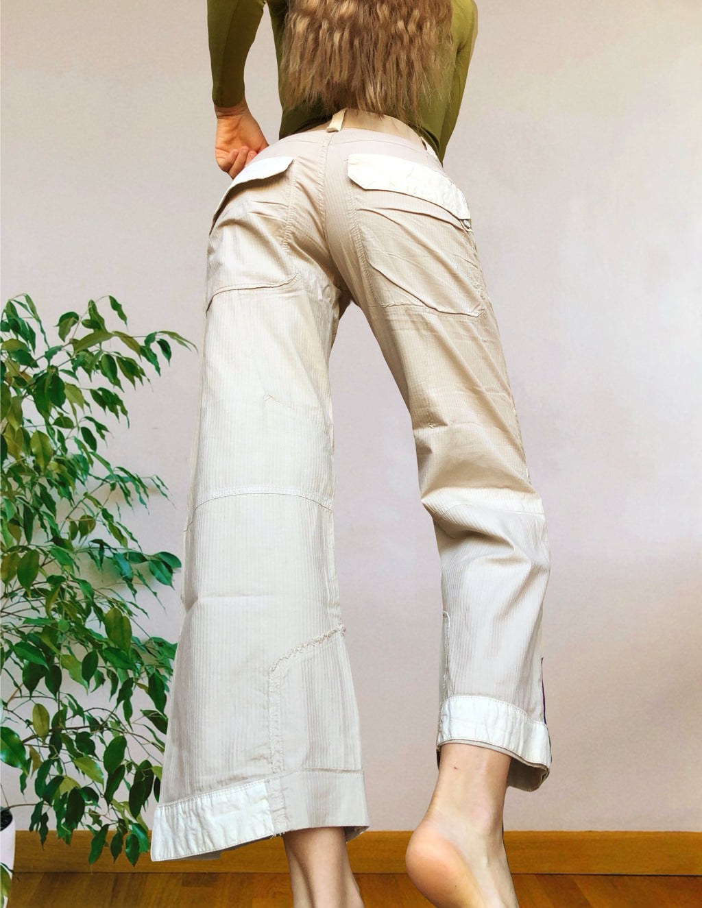 Beige wide-leg cargo pants with light-colored inserts