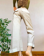 Beige wide-leg cargo pants with light-colored inserts