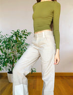 Beige wide-leg cargo pants with light-colored inserts