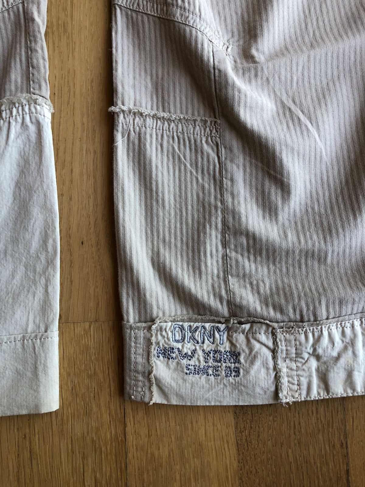Beige wide-leg cargo pants with light-colored inserts