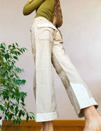 Beige wide-leg cargo pants with light-colored inserts