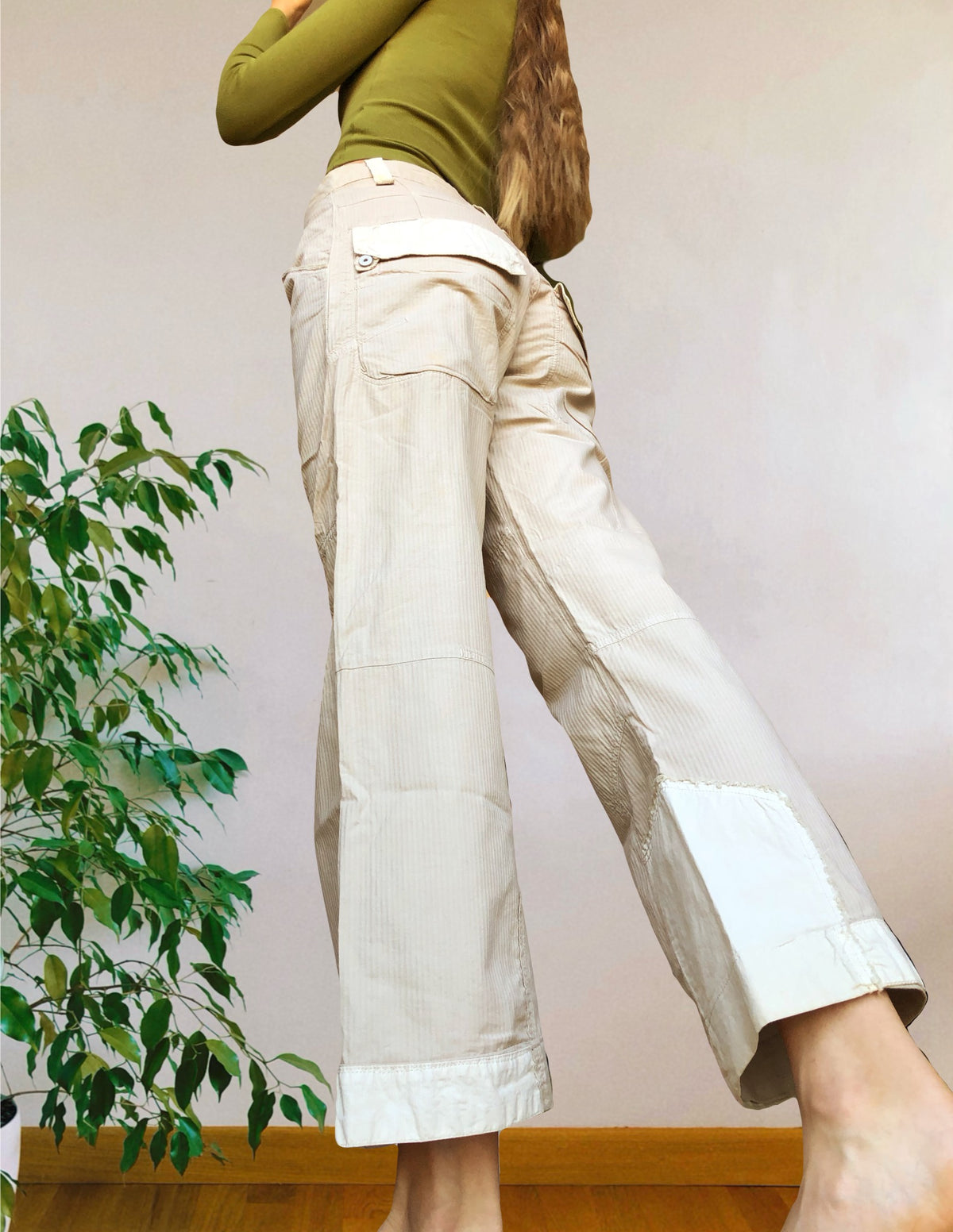 Beige wide-leg cargo pants with light-colored inserts