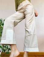 Beige wide-leg cargo pants with light-colored inserts