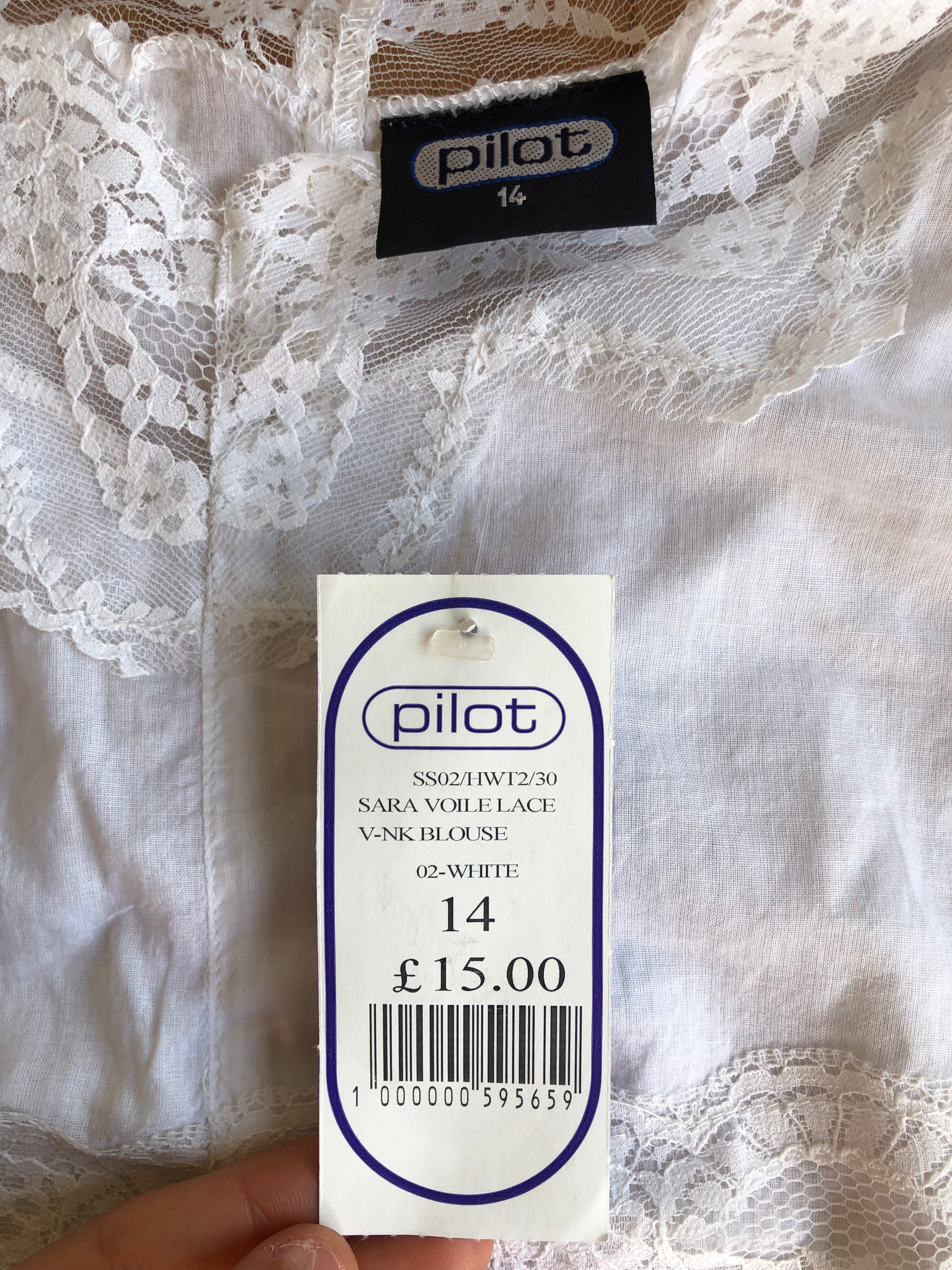 Blusa bianca scollo ampio ricamata