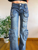 Jeans vintage anni 90 svasati. Molteplici tasche tonde