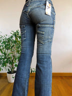 Jeans Vintage anni 90 con sagomature chiare. Svasati zip in fondo