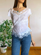 Blusa bianca scollo ampio ricamata