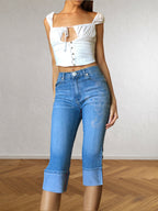 Jeans Capri con strass a forma di Scorpione