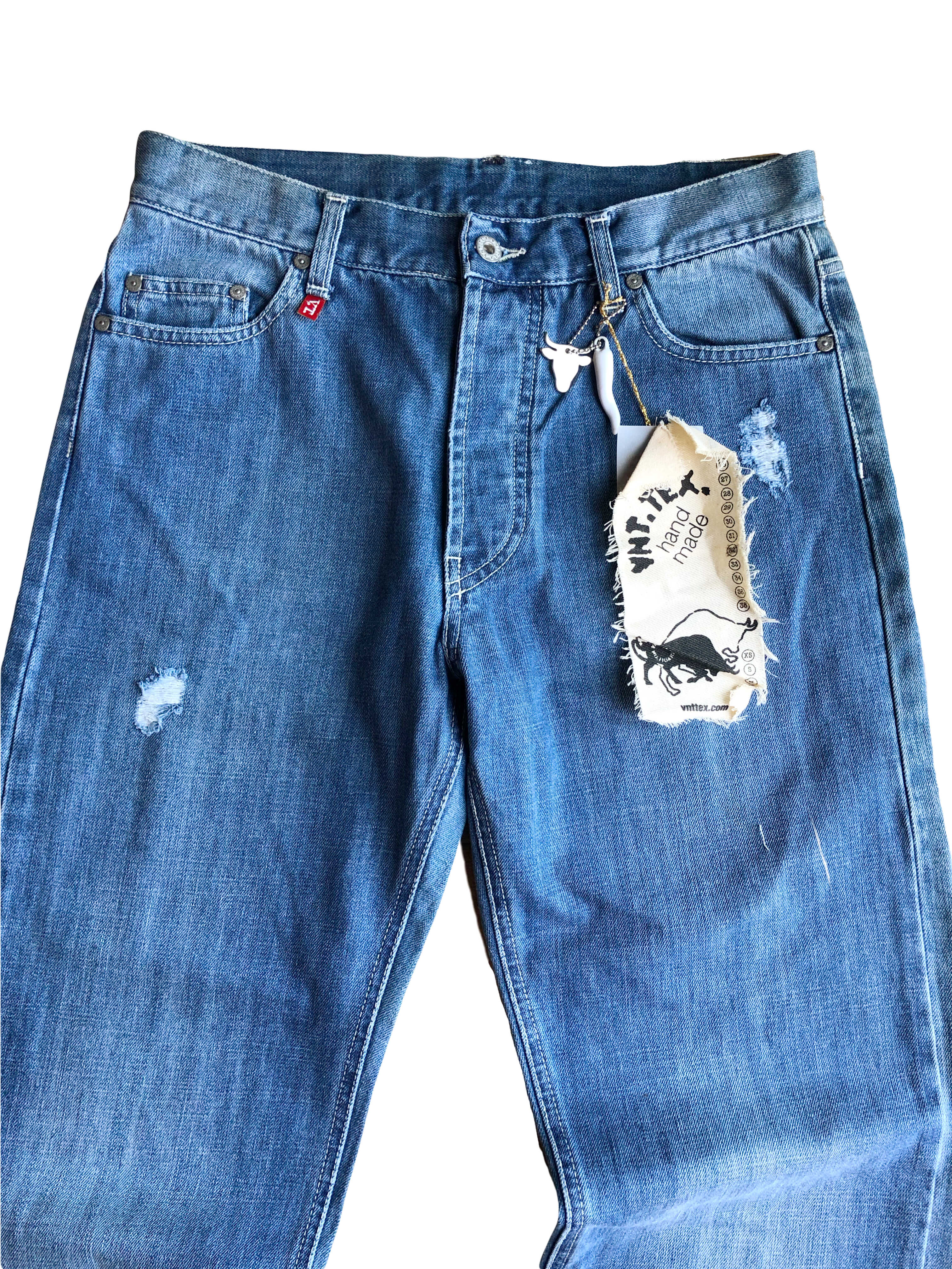 Jeans anni 90 a palazzo. Dettaglio con Toro